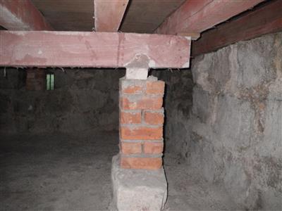 The empty space remains in use under the present premises for ventilation and termite control purposes.